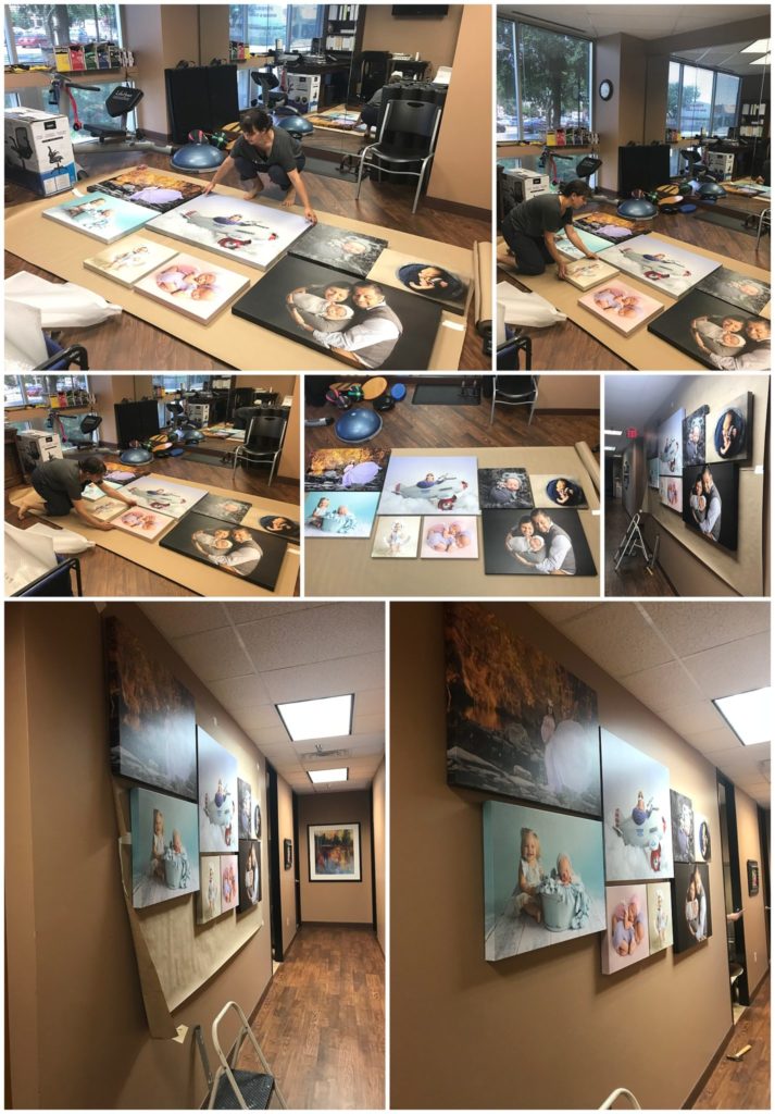 step by step process of laying out and hanging up pieces of wall art featuring pictures of pregnant moms and newborns for chiropractic office in North Dallas