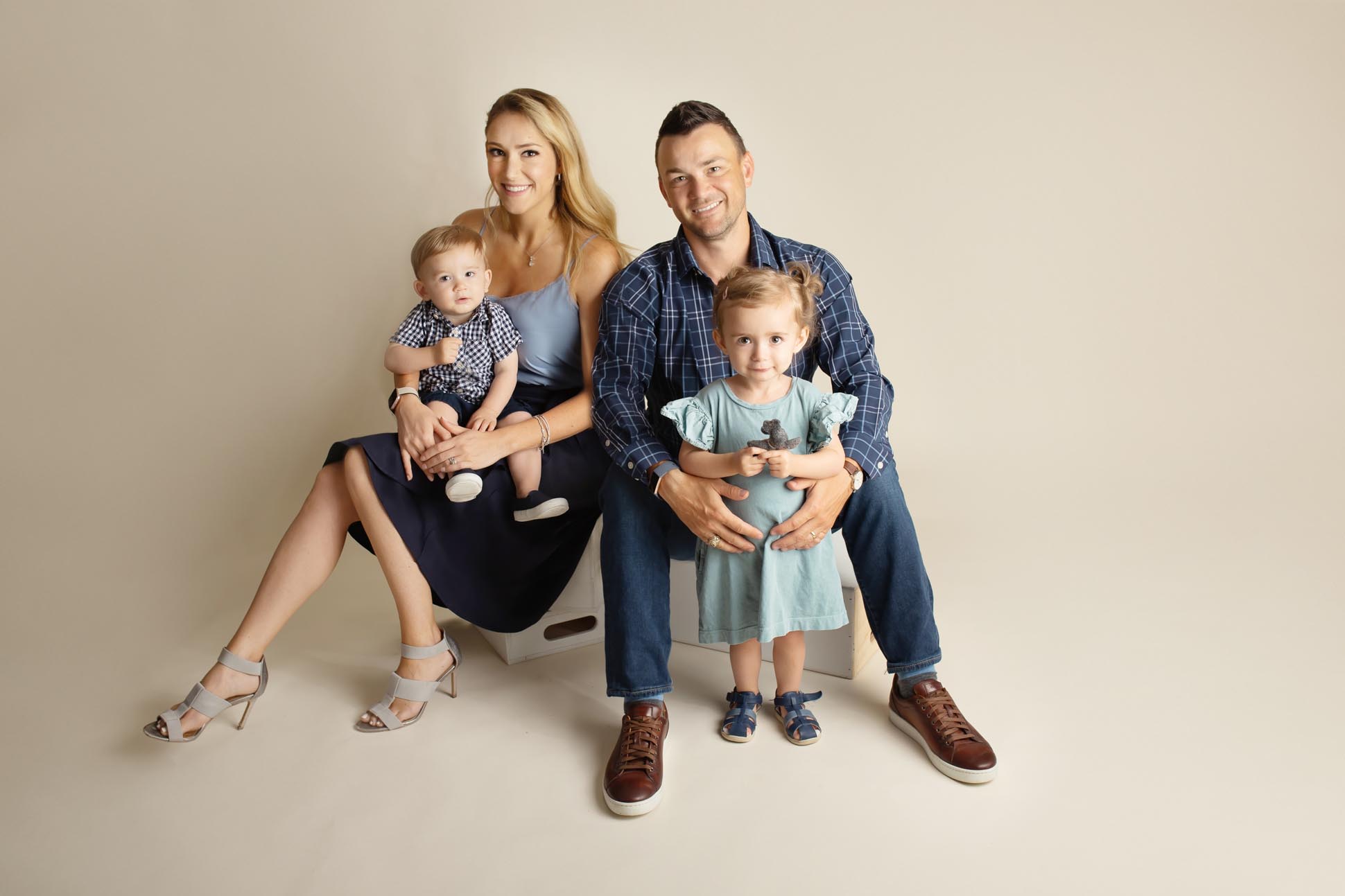 Dallas family photographer displays picture of young family during a studio portrait session
