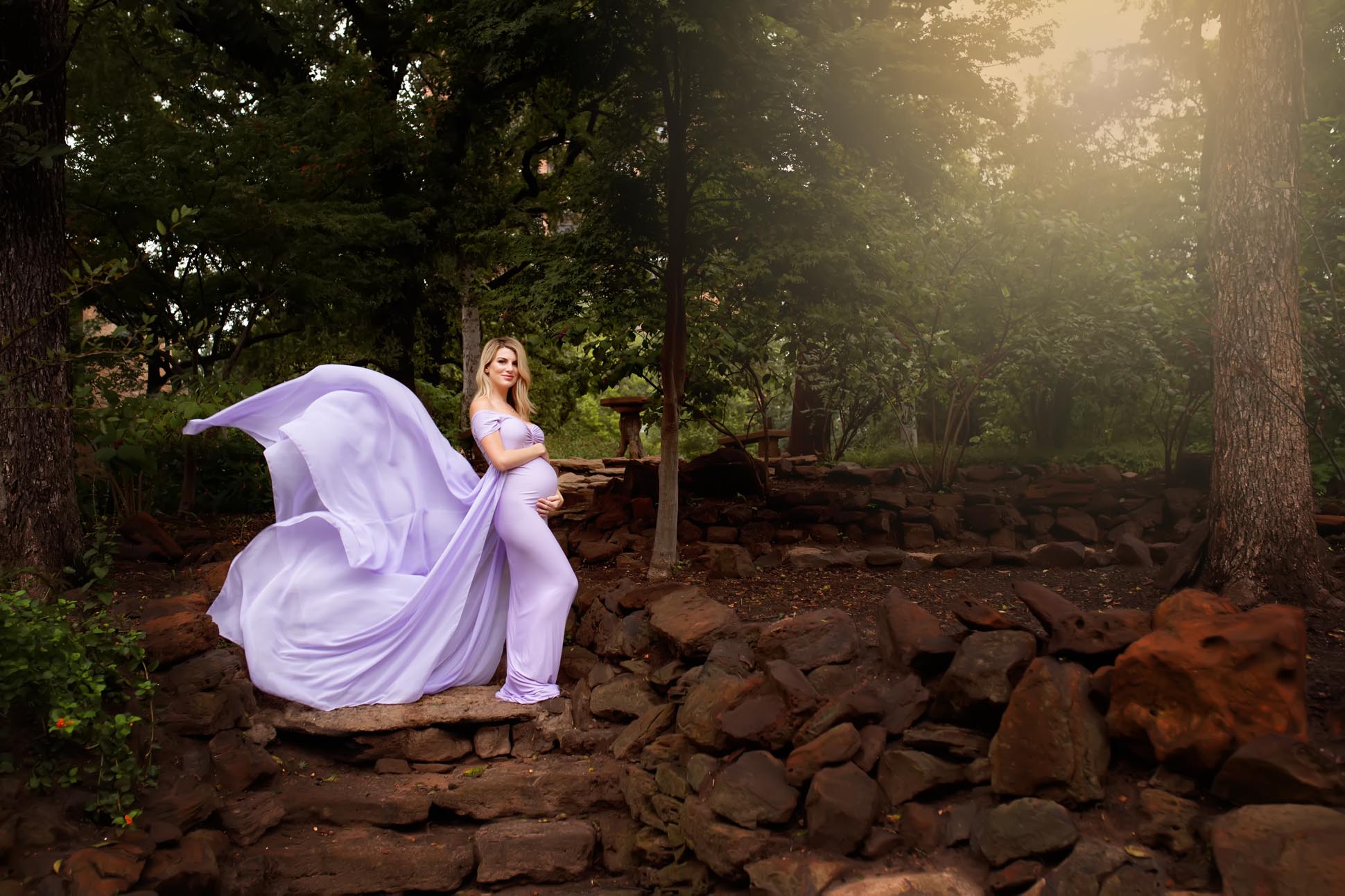 Dallas maternity photographer poses mom to be in mii estilo lavender designer dress in gardens at TWU in Denton Texas.